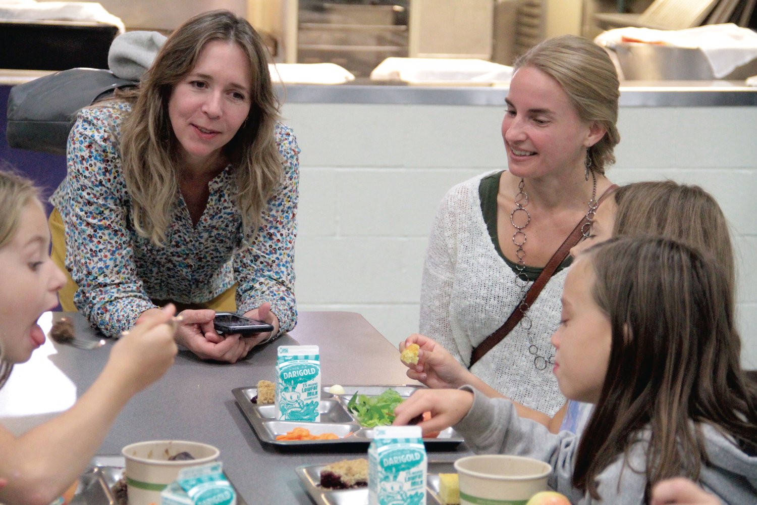 Laura Raymond, the Regional Markets Program Manager for the Washington State Department of Agriculture, talks with Quilcene students during her recent visit to the school.